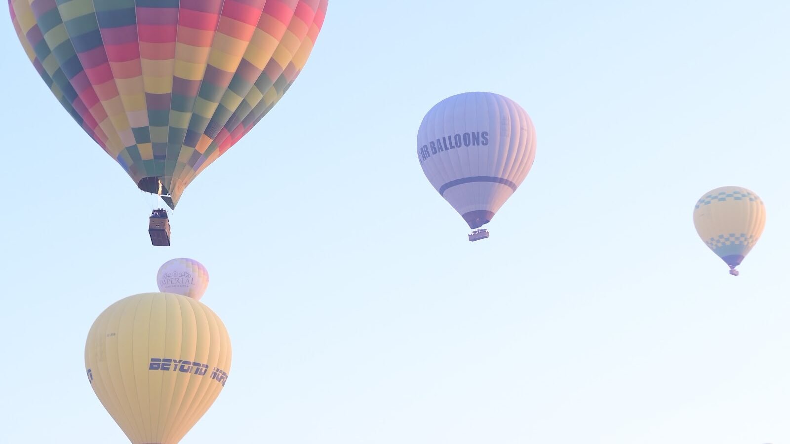A flotilla of balloons at sunrise over Luxor