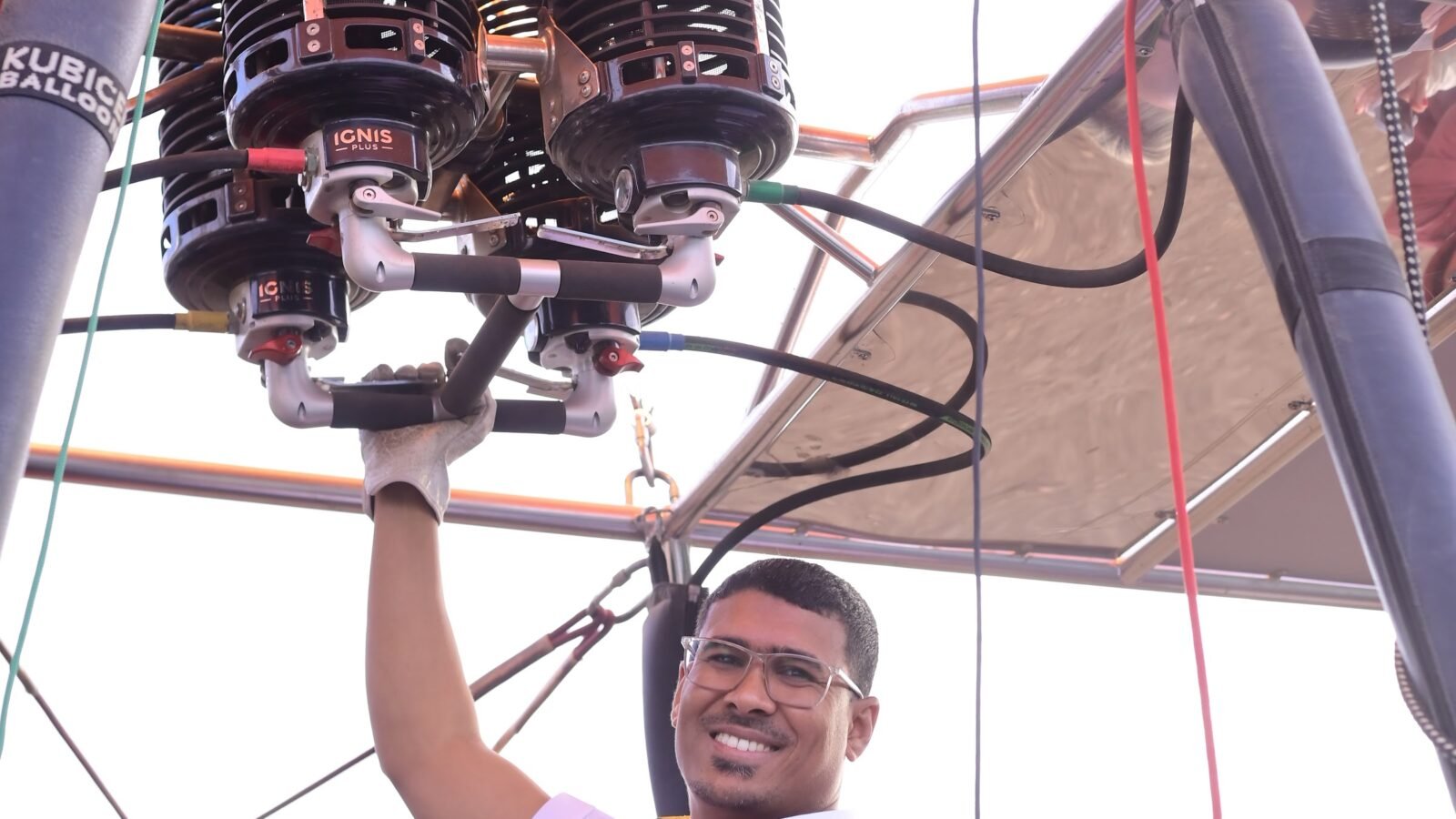 Captain Mo working the burner controls as the balloon is readied at dawn in Luxor