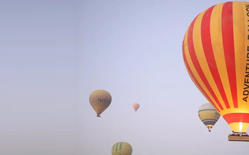 Hot air balloons over Luxor at sunrise, part of the balloon and sunset felucca Nile experience