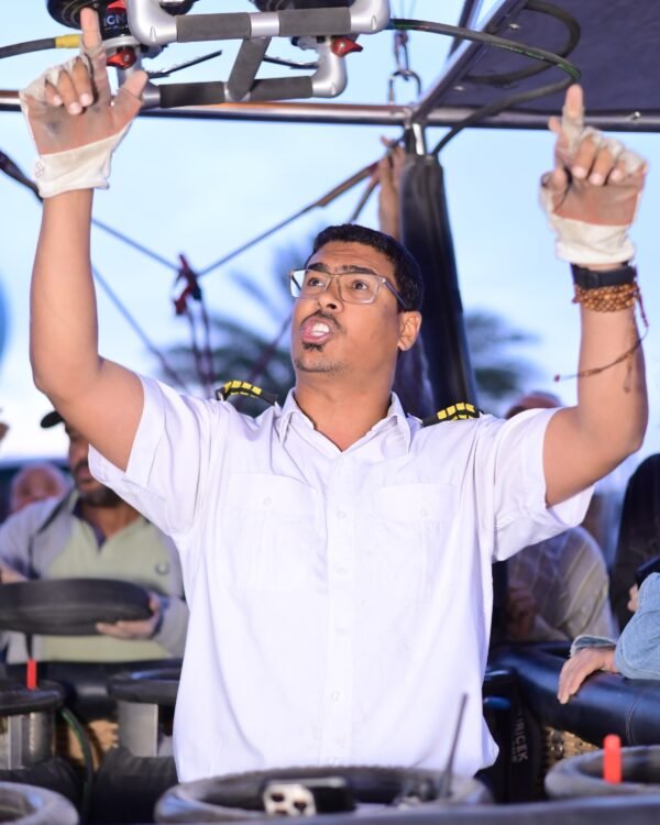 Captain Mo reaching up to the burners mid flight over Luxor